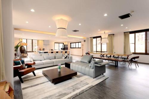a large living room with couches and a table at ラルパレット白馬 in Hakuba