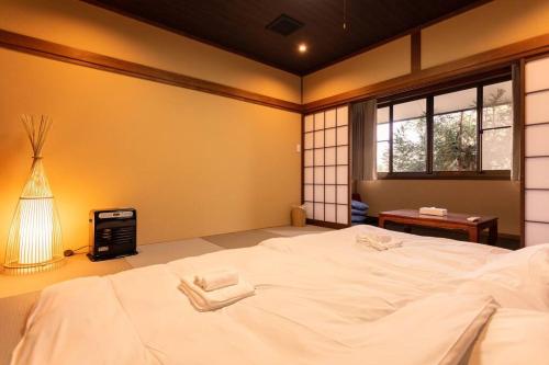 A bed or beds in a room at ラルパレット白馬