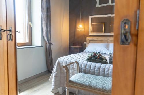 Postel nebo postele na pokoji v ubytování Palazzo NiTe