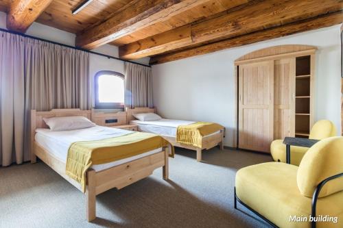 Postel nebo postele na pokoji v ubytování Hotel Spichrz