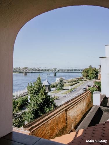 a view of the river from a building at Hotel Spichrz in Toruń