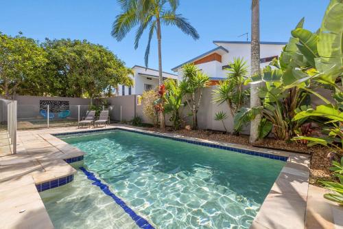 a swimming pool in the backyard of a house at Ocean Blue On Salt Beach in Kingscliff