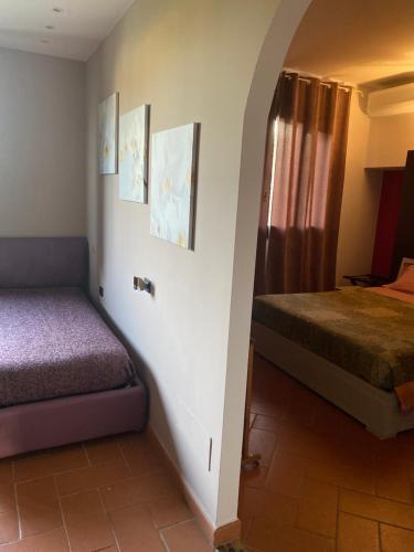 a bedroom with two beds and a window in it at A CASA DI TERE in Medicina