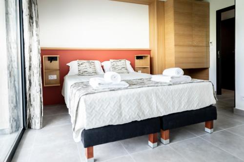 Ένα ή περισσότερα κρεβάτια σε δωμάτιο στο hôtel résidence a torra