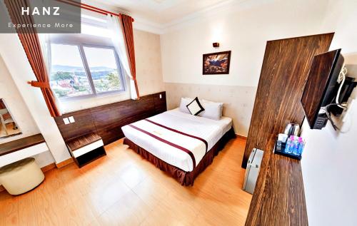 Giường trong phòng chung tại HANZ Thien Nien Ky Hotel