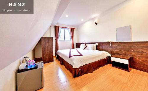 En eller flere senge i et værelse på HANZ Thien Nien Ky Hotel