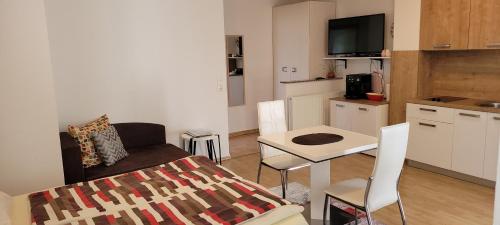 a small living room with a couch and a table at Apartments in Krk in Krk