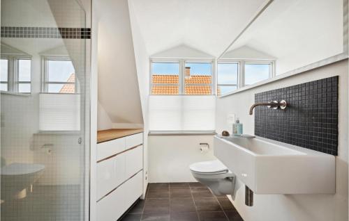 a bathroom with a sink and a toilet at Lovely Home In Svendborg With Wifi in Svendborg