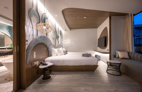 Postel nebo postele na pokoji v ubytování Metadee Concept Hotel