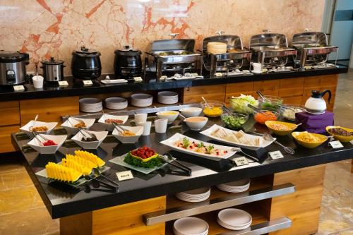 a buffet with a lot of food on a table at 沐棧行旅-花蓮Muchan Hotel-Hualien in Jian