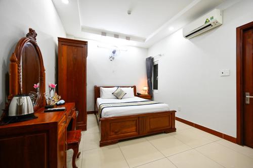 Postel nebo postele na pokoji v ubytování Sky Star Hotel