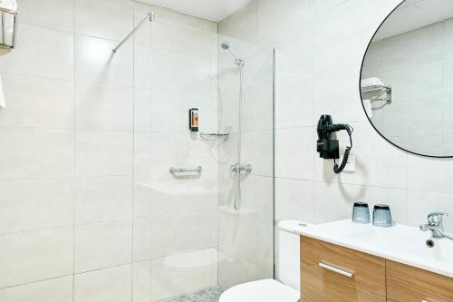 a bathroom with a shower and a toilet and a sink at tent Torremolinos in Torremolinos