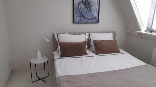 Postel nebo postele na pokoji v ubytování Vince appartement Culemborg