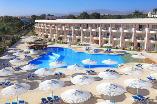 an aerial view of a hotel with umbrellas and a pool at Labranda Royal Makadi in Hurghada