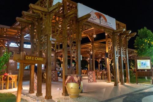 a large wooden structure with a table and chairs at Labranda Royal Makadi in Hurghada