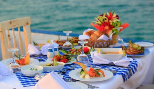a table with food on a blue and white table cloth at Labranda Royal Makadi in Hurghada