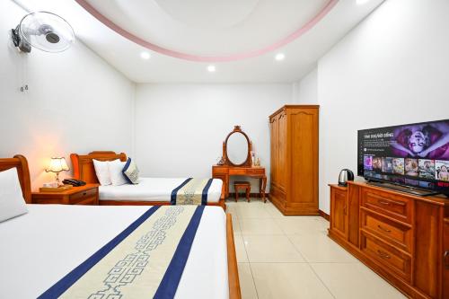 Postel nebo postele na pokoji v ubytování Sky Star Hotel