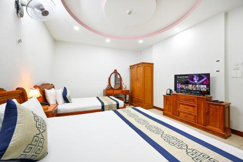 Postel nebo postele na pokoji v ubytování Sky Star Hotel