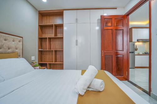 a bedroom with a bed with two towels on it at Spring Hill Apartment -The High Class in Ho Chi Minh City