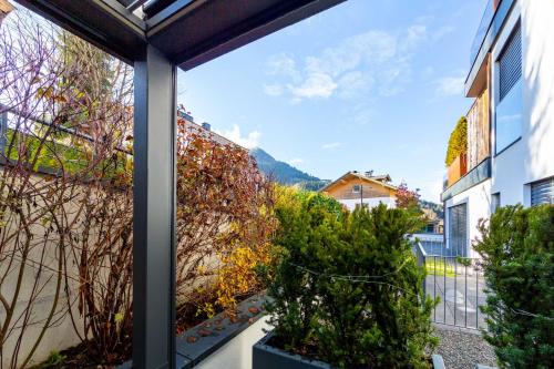 a view from the balcony of a house with plants at Mountain Chalet Kirchberg by Apartment Managers in Kirchberg in Tirol