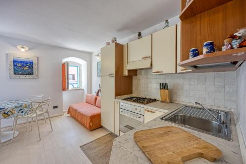 a kitchen with a sink and a counter top at Astra 1 Veli Lošinj Harbour View - Happy Rentals in Veli Lošinj