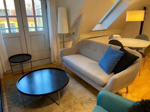 a living room with a couch and a table at City Center Apartments 187 in Copenhagen