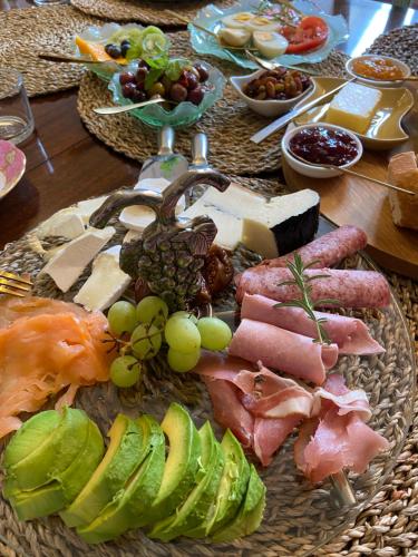 a table with a bunch of different types of food at Champagne House - Elegance, Luxury and Charm in Condom