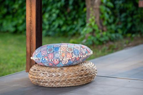 a large bowl sitting on top of a basket at Amo el mar Porto Koufo in Porto Koufo