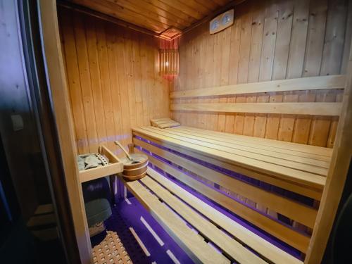 a wooden sauna with a toilet in it at Royal Mediterran in Siófok