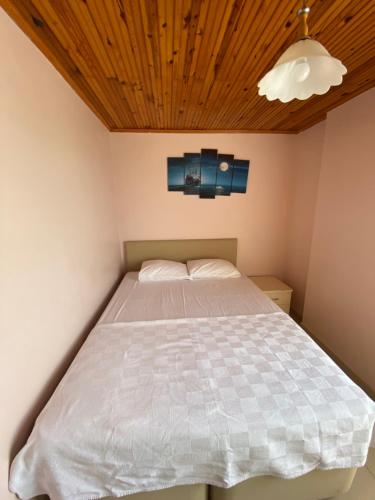 Ένα ή περισσότερα κρεβάτια σε δωμάτιο στο Lapina Suite & Restaurant