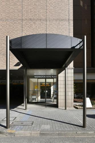 a building with a black canopy in front of it at Nagoya Sakae Washington Hotel Plaza in Nagoya