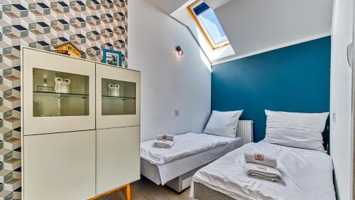 Ένα ή περισσότερα κρεβάτια σε δωμάτιο στο Apartament Szary Kamień w Świeradowie Zdrój - 5D Apartamenty