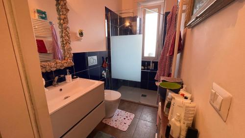 a small bathroom with a sink and a toilet at BnB Tripoli in Turin
