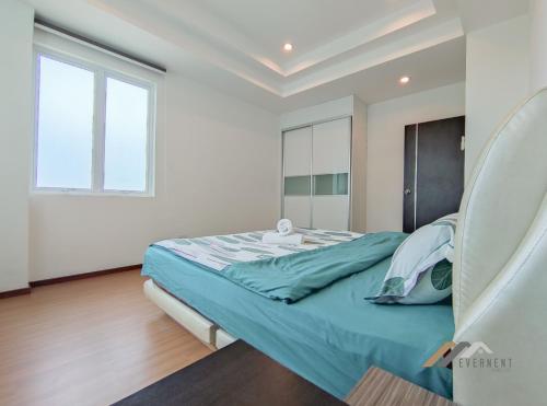 a bedroom with a bed and a window at Serene Heights by Evernent in Miri