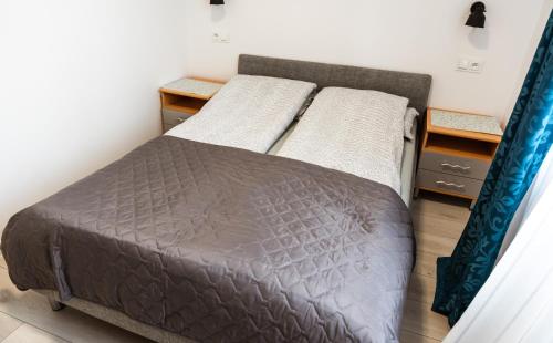 Posteľ alebo postele v izbe v ubytovaní apartament dla 4 osób blisko morza