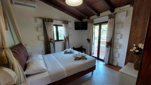 a bedroom with a bed with flowers on it at Neriana Villa - Garden Paradise in Chania Town