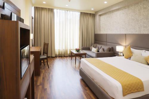 Postel nebo postele na pokoji v ubytování Boulevard 9 Luxury Resort & Spa