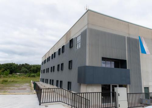 a building with a black fence in front of it at ESTRELA DO CAMIÑO in Palas de Rei 