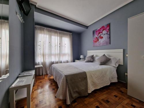 Postel nebo postele na pokoji v ubytování Hostal Fidalgo