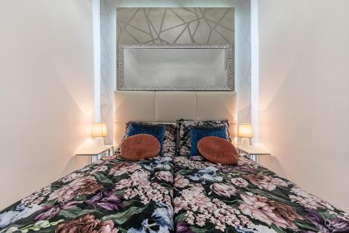 a bedroom with a bed with two pillows at Luxury apartment with free garage and balcony in the center in Budapest