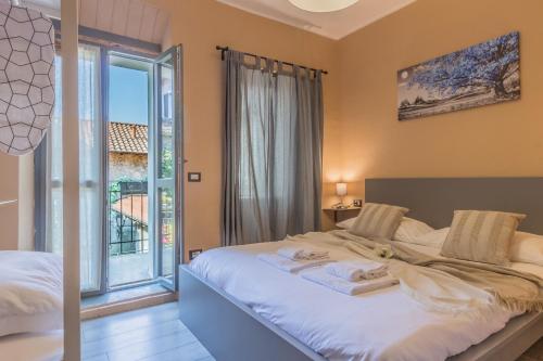 Ένα ή περισσότερα κρεβάτια σε δωμάτιο στο Casa Cavalli Varenna