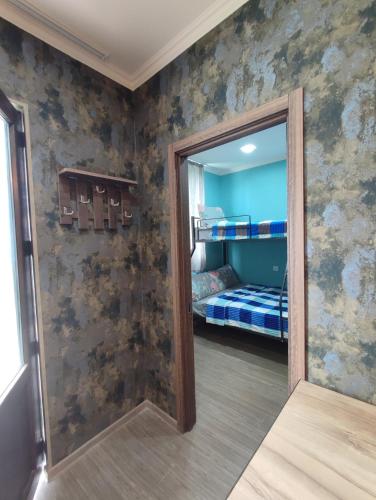 a bedroom with a mirror and a bunk bed at Ananuri Cottages in Ananuri