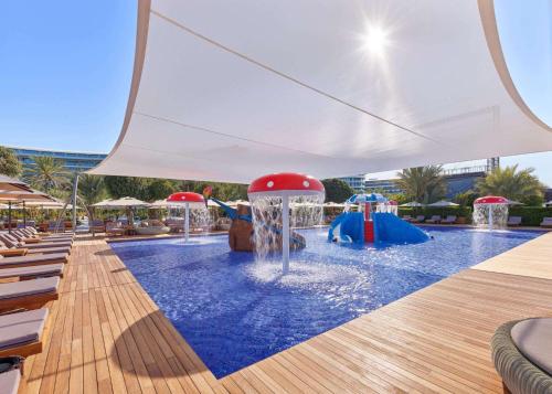 a pool with a water park with two water slides at Maxx Royal Belek Golf Resort in Belek