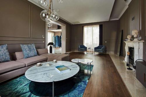 a living room with a couch and a table at Maxx Royal Belek Golf Resort in Belek