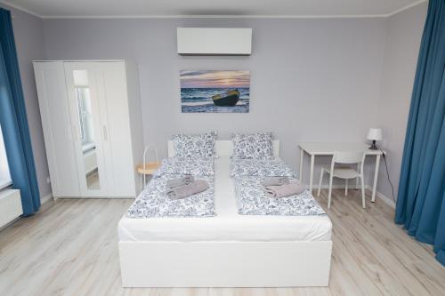 Posteľ alebo postele v izbe v ubytovaní Apartamenty 4YOU Hel