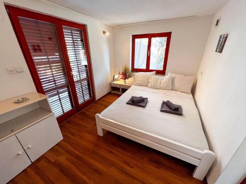 En eller flere senge i et værelse på Robinson Ina 3