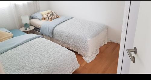 Postel nebo postele na pokoji v ubytování La perle du lac