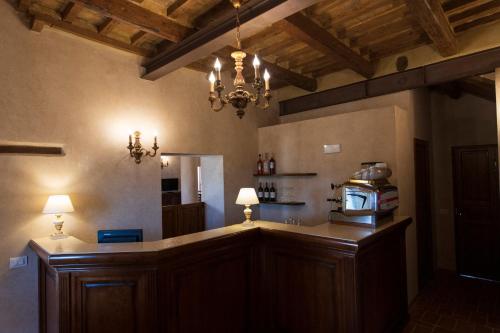a kitchen with a counter with a microwave on it at Locanda di Montegiove in Fano
