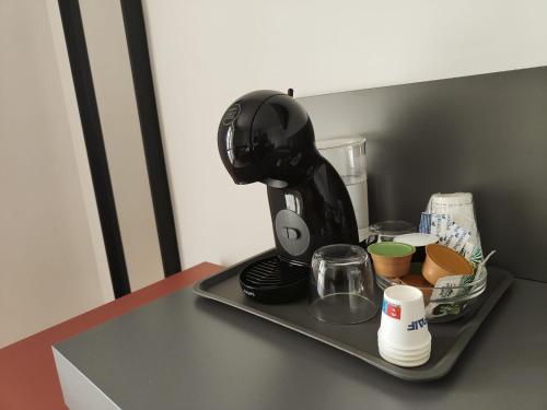 Set per la preparazione di tè e caffè presso Rosa Rooms Pompei