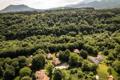 an aerial view of a house in the middle of a forest at Gabarite Holiday Village in Apriltsi